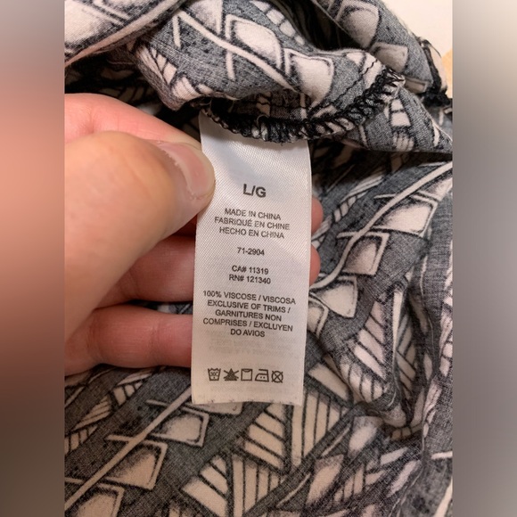 Black and tan geometric short sleeve tunic with cut out back from Dynamite - Picture 13 of 14